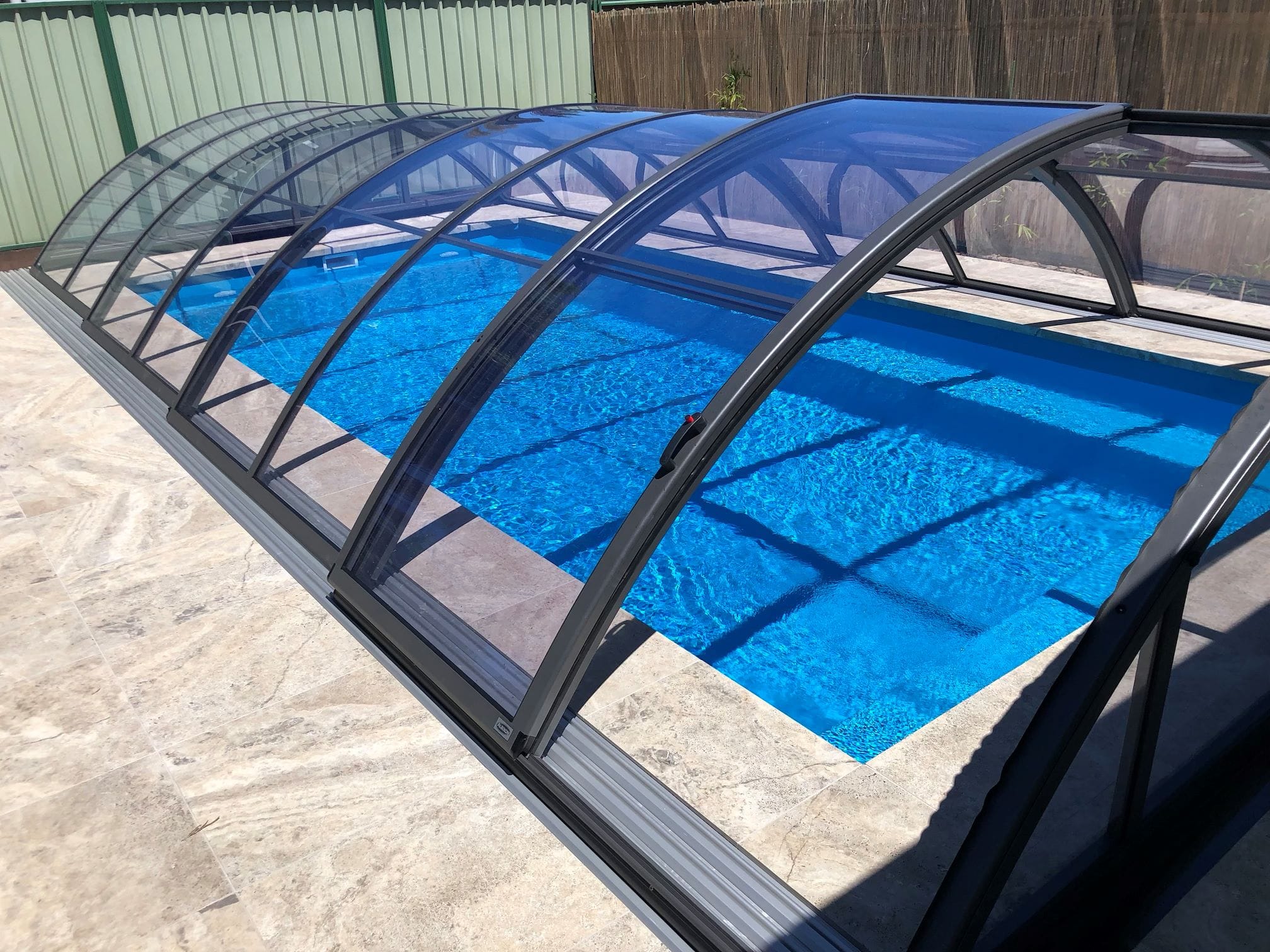 Slide side door pool enclosures